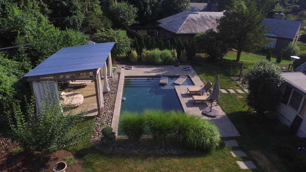 Suburban Backyard With a Large In-Ground Pool and Cabana