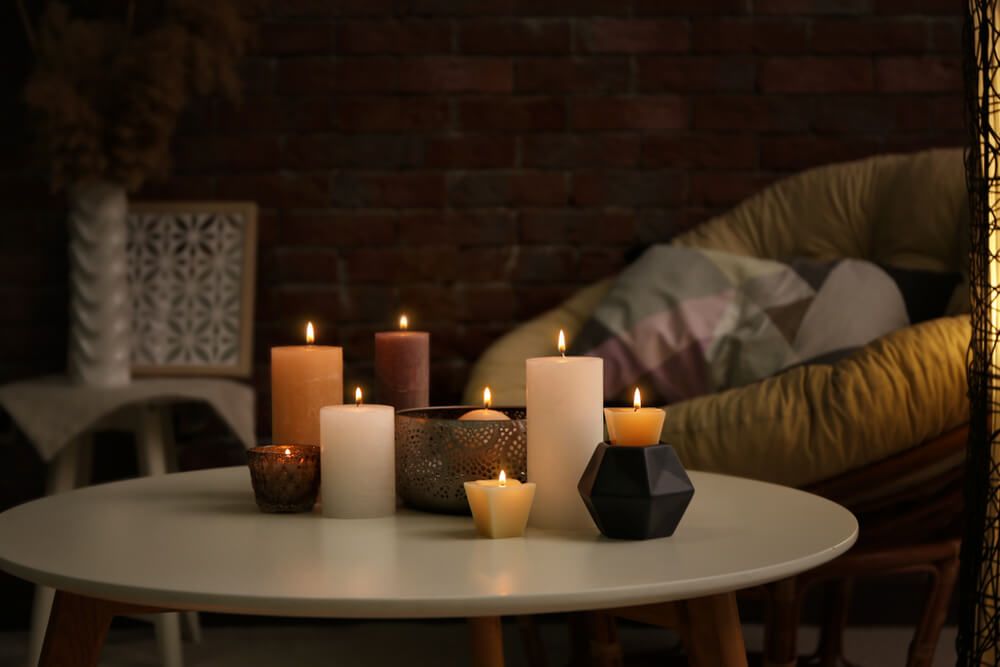 Burning candles on a coffee table 