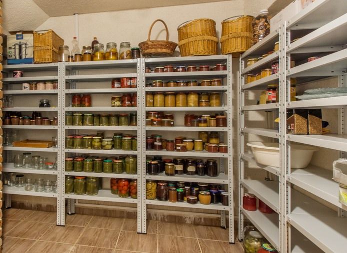 Canned jars with food stuffs lined on shelves