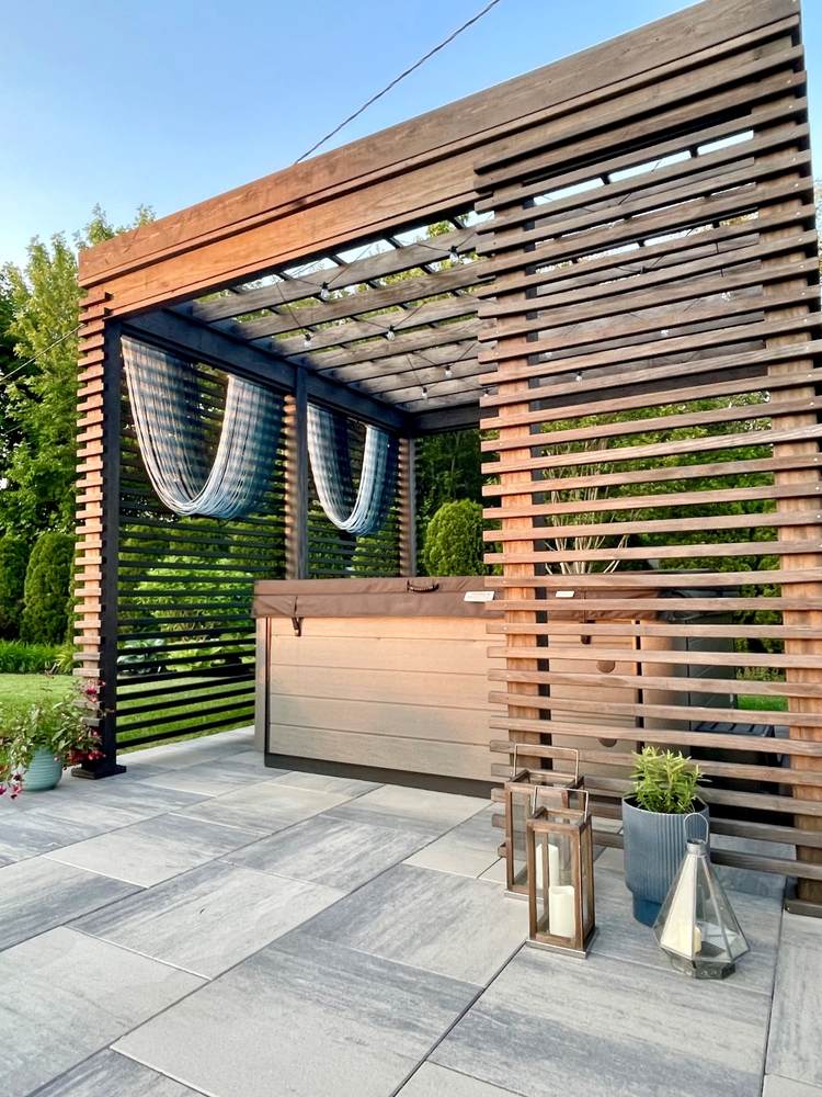 outdoor patio with a hot tub