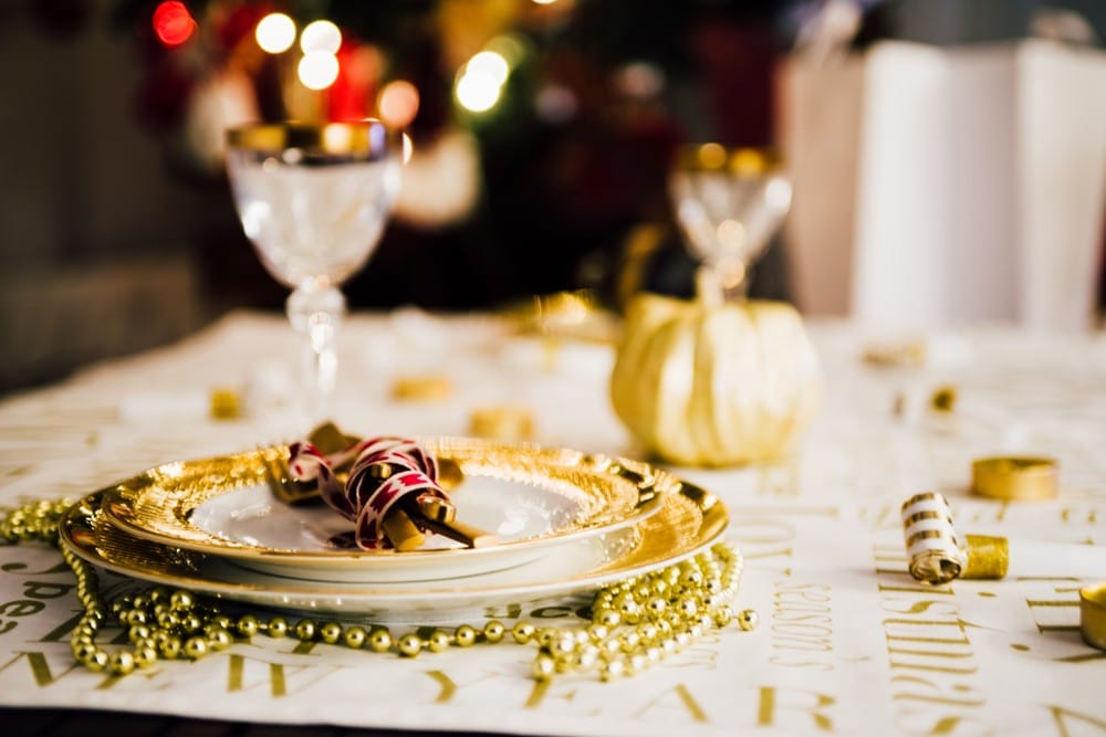 new year table setting with exclusive and luxury golden cutlery