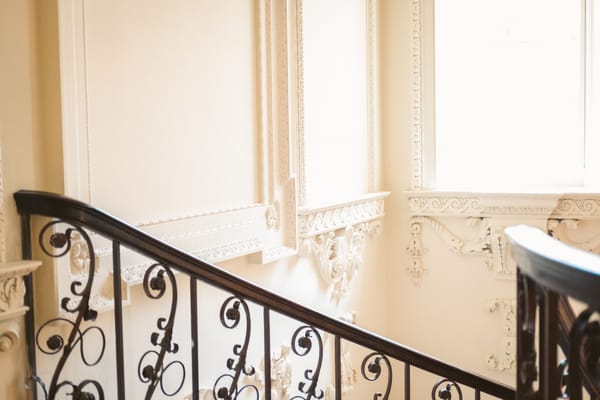 staircase with decorate wall moldings