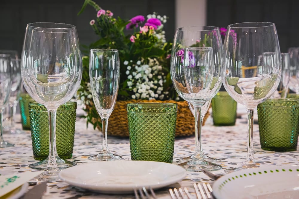 New Year's Eve table setup with green glasses