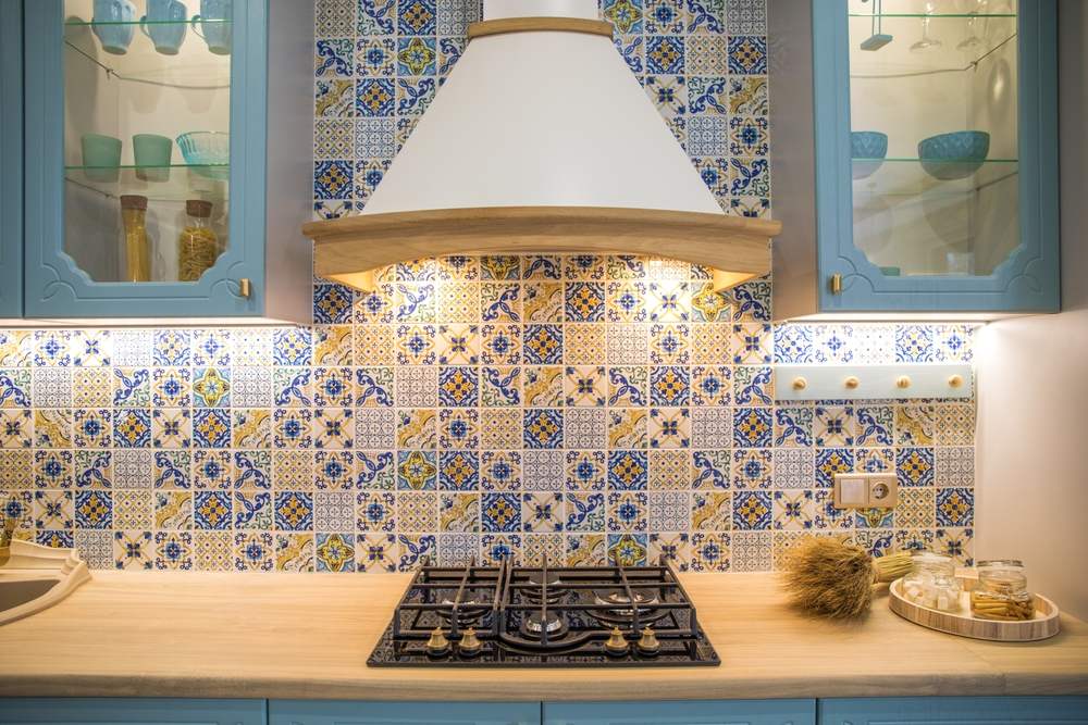 flowery backsplash and turquoise tiles