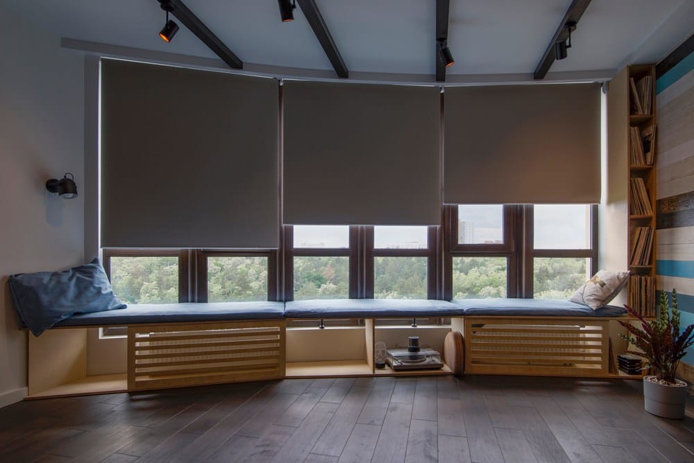 Large windows with motorized roller shades