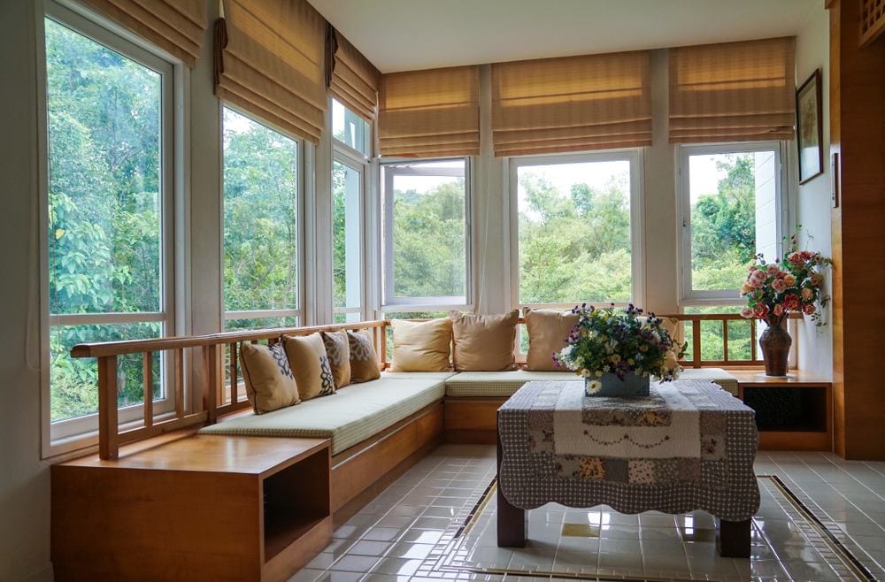 room with brown roman blinds in a sitting nook