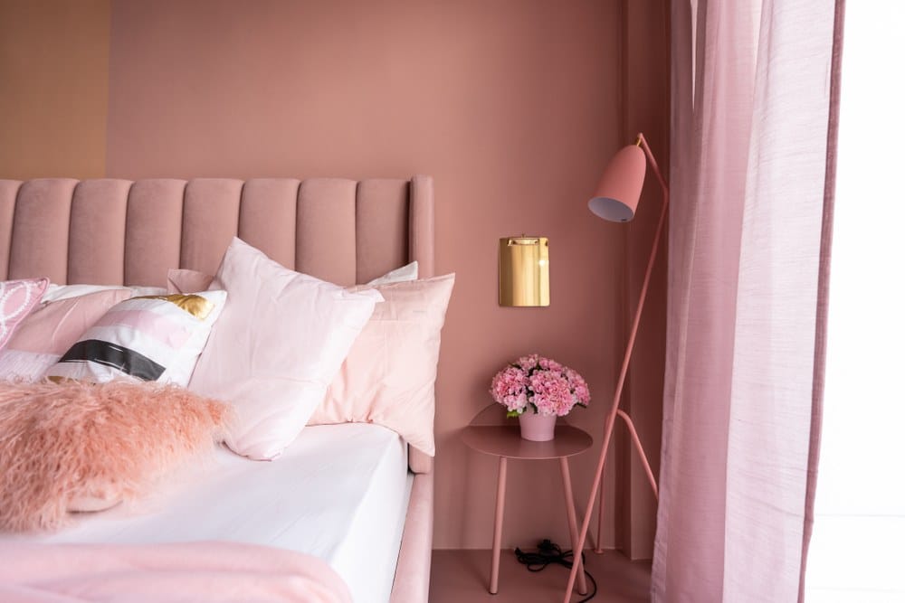 pink bedroom with mixed bedding