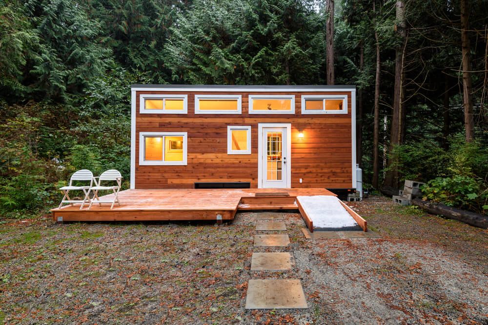 Small wooden cabin house in the evening.