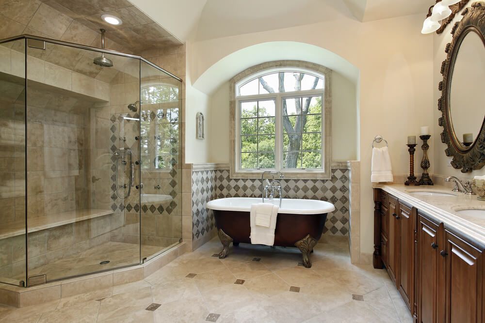 Master bath in luxury home with glass shower