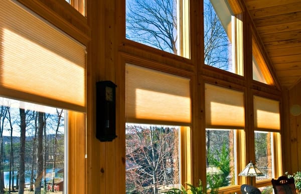 Large windows in a house showing the window treatments.